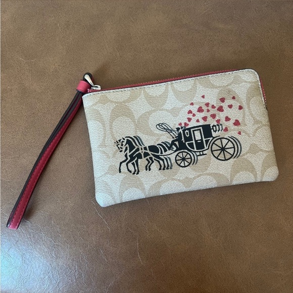COACH Corner Zip Wristlet In Signature Canvas With Horse & Carriage Hearts Motif - Picture 2 of 15